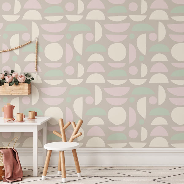 Pastel colored stones wallpaper with circles and arcs, providing a cheerful, modern decor for Scandinavian or mid-century inspired spaces. This traditional unpasted wallpaper is ideal for bathrooms or nurseries, offering a clean, smooth finish with eco-friendly materials.