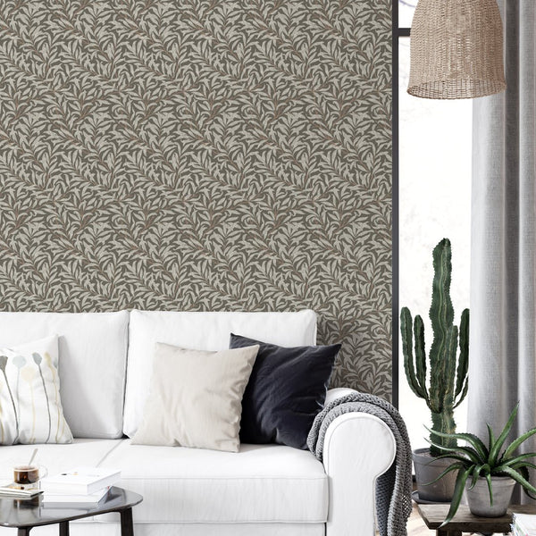 Willow bough pattern with diagonal stems and linear leaves on a taupe-brown base, providing a calming atmosphere for bedrooms. This removable wallpaper is ideal for decorators seeking a heritage look.