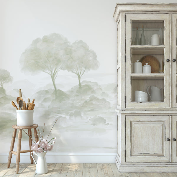 Neutral sage wallpaper with dreamy watercolor trees, light foliage and subtle natural details for a minimalist bedroom interior.