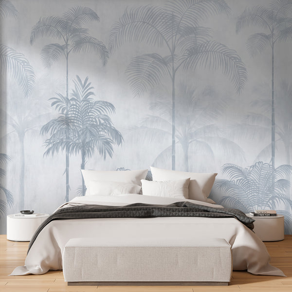 Neutral blue palm tree wall mural featuring delicate tropical trees and softly faded foliage for a modern living room or bedroom accent wall.