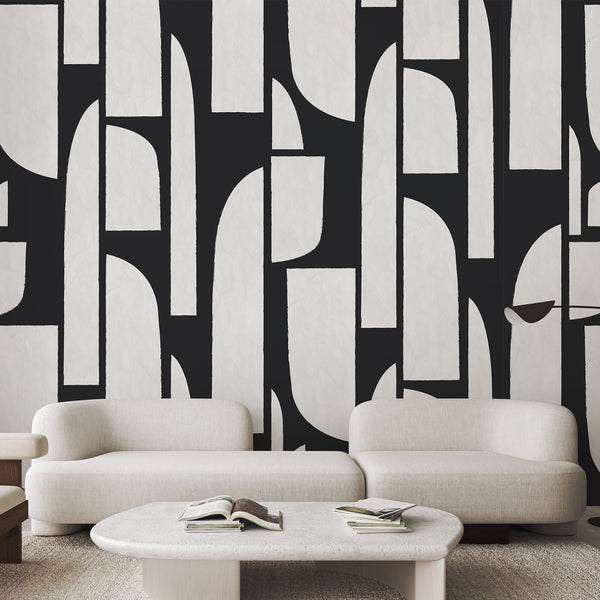 Close-up of black geometric shapes on a white textured background, forming a rhythmic pattern with minimal negative space. The directional, large-scale motif suits a home office or hallway seeking a strong focal wall. Easy to apply and reposition, this temporary wallpaper is perfect for bold interior design statements.