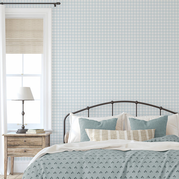 Farmhouse checkered wallpaper in pastel blue and white with delicate linear texture for a cozy cottage bedroom or nursery accent wall.