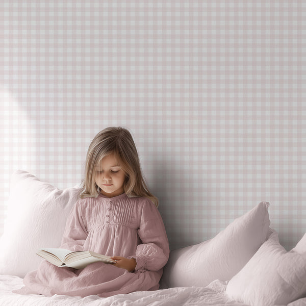 Blush pink checkered wallpaper with layered plaid lines and crisp white squares, ideal for a nursery, bedroom, or cottage-style interior.