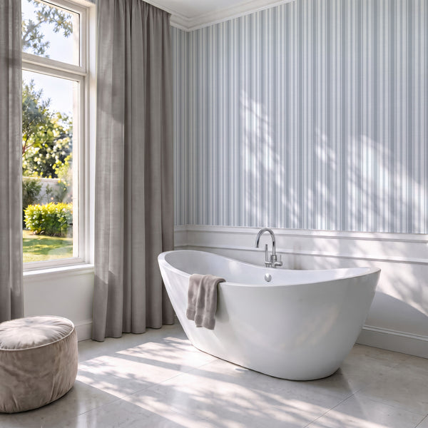 Vintage striped wallpaper with soft blue gray vertical lines creating a timeless look for coastal farmhouse and cottage-style interiors.