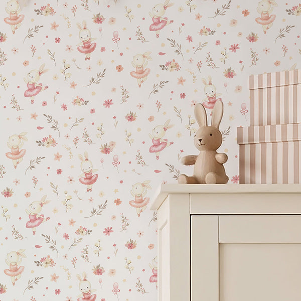 Pink bunny ballerina wallpaper featuring a watercolor rabbit in a blush tutu with soft flowers, leafy sprigs, and tiny stars on a white background.