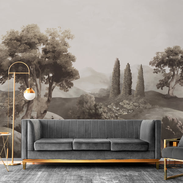 Vintage countryside wallpaper in warm brown and taupe features tall cypress trees and layered hills for an elegant living room accent wall.