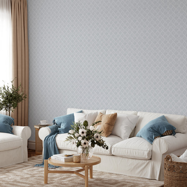 Vintage-inspired damask wallpaper with gray-blue motifs on a pale background, best for creating an elegant accent wall in modern farmhouse decor.
