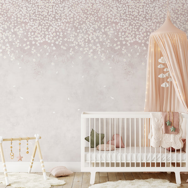 Romantic pink botanical wallpaper featuring delicate blossoms scattered across a soft watercolor background for an elegant bedroom or nursery accent wall.