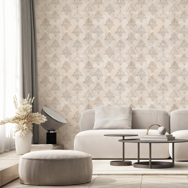 Neutral beige wallpaper featuring weathered damask floral motifs over a softly aged textured background for an elegant vintage bedroom or living room.
