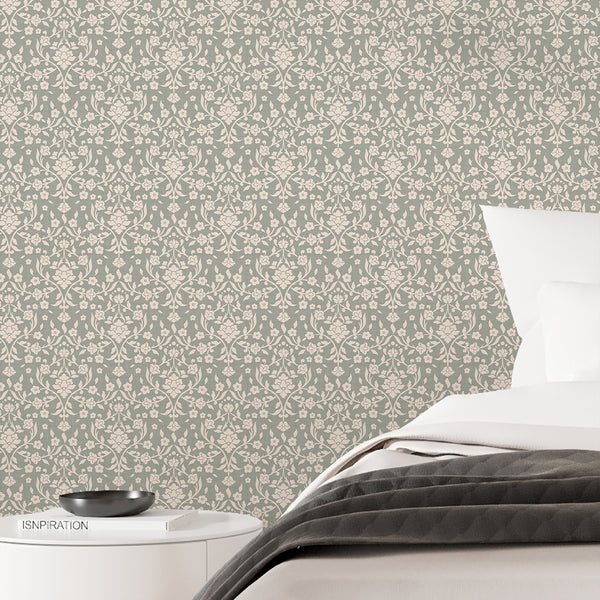 Vintage farmhouse damask wallpaper featuring cream floral silhouettes and elegant winding vines against a sage green textured background for bedroom walls.