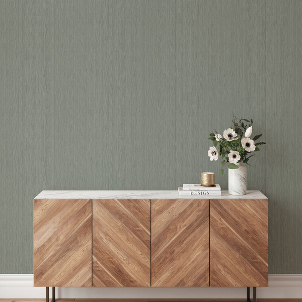 Fine vertical line wallpaper in sage green, offering a calm modern accent wall in Scandinavian hallways.