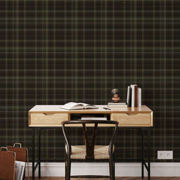 Dark geometric wallpaper with layered horizontal and vertical tartan stripes, fine zigzag detailing, and earthy green shades for a masculine home office.