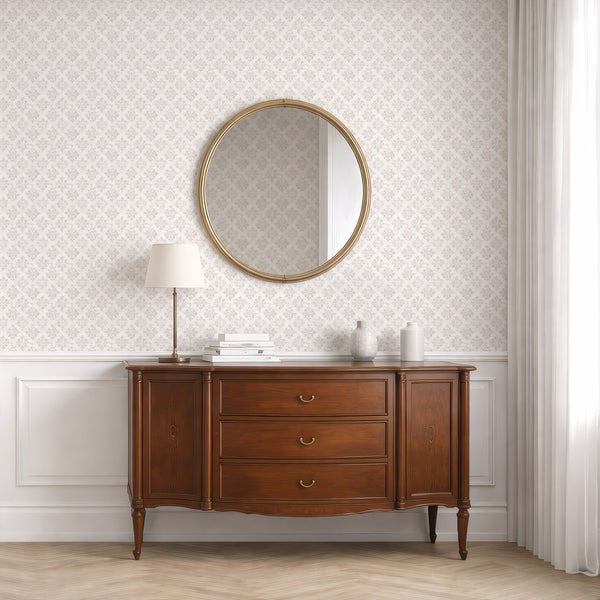 Neutral beige damask wallpaper with floral medallions and leaf motifs, offering a hand-brushed and softly aged appearance. This wallpaper is made in the USA from high-quality removable material, perfect for accent walls in living rooms or bedrooms, enhancing any interior design with its classic charm.