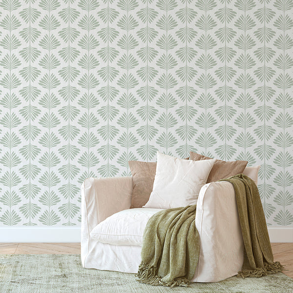 Pale sage green palm leaves create a calming wallpaper design with a subtle linen texture, ideal for modern coastal interiors. The self-adhesive quality ensures easy application and removal, perfect for renters and designers.