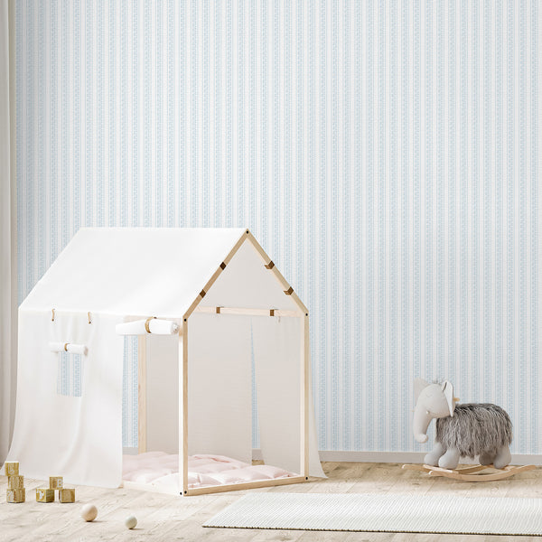 Blue floral wallpaper with repeating vertical stripes, white botanical flowers, and a textured background that suits nurseries, bedrooms, and cozy spaces.