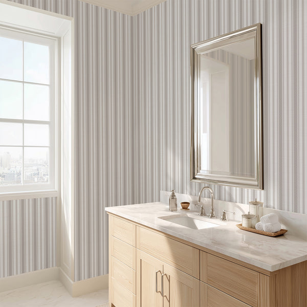 Vintage striped wallpaper with delicate beige gray vertical stripes on a soft white background, creating a timeless look for farmhouse and cottage-style interiors.