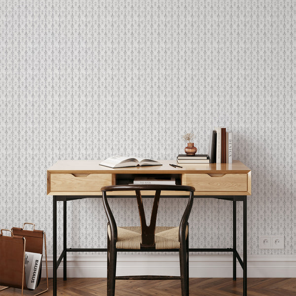 Stylized gray damask wallpaper featuring a vintage-washed texture, ideal for creating a refined, timeless look in modern farmhouse or French country spaces. The removable wallpaper's narrow pattern enhances the sophistication of hallways or living rooms.