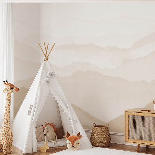 Beige watercolor mountain wall mural with soft layered hills and warm neutral tones, creating a minimalist landscape for a modern bedroom or living room.