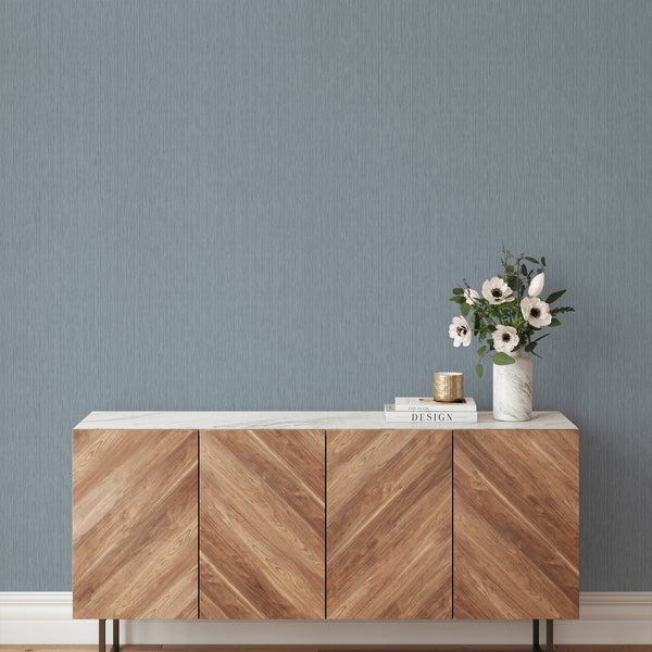 Fine striated lines in dusty blue create a soft, elevated look for walls, ideal for studies and hallways.