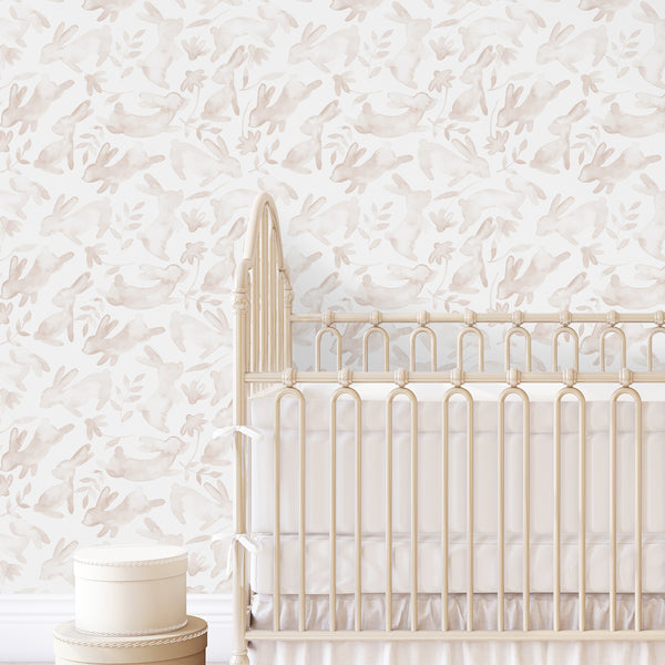 Bunny nursery wallpaper features hand-painted beige rabbit profiles and small botanical elements. The medium-scale repeat on a clean white background suits calm bedrooms and modern farmhouse interiors. This self-adhesive, easy-to-apply wall decor is crafted from high-quality removable material, offering a gentle, playful ambiance.