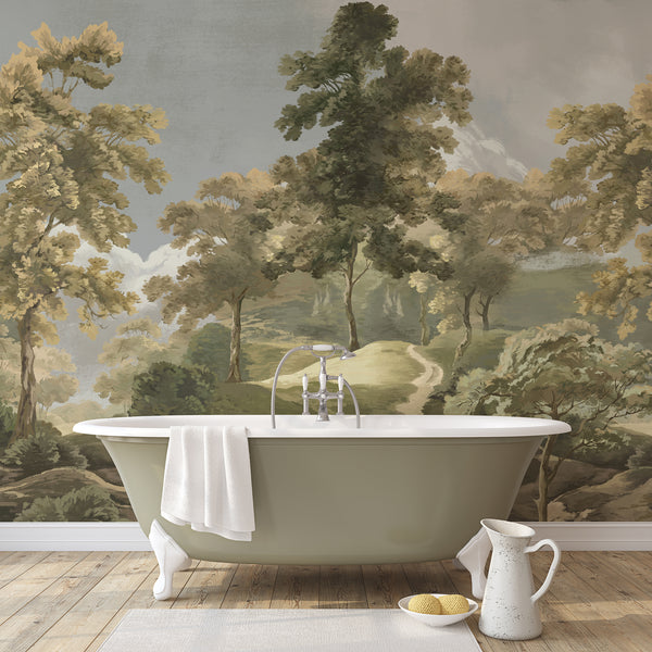 Scenic green wall mural with layered forest trees, rolling countryside and a winding pathway in muted olive, beige and soft gray shades.
