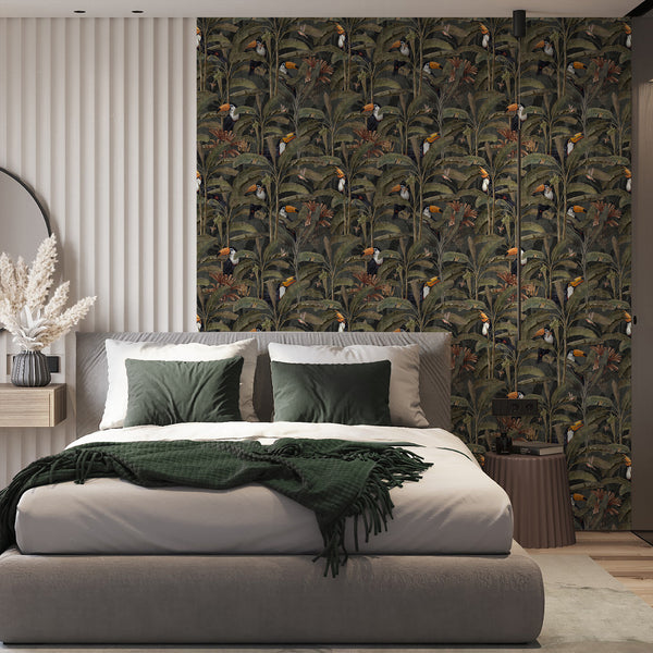 Dark botanical bird wallpaper with black and white toucans, orange beaks and muted green foliage, ideal for a sophisticated tropical dining room.