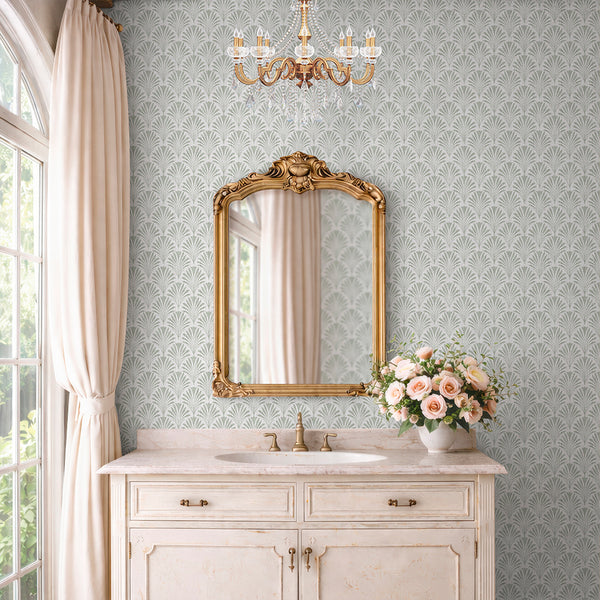 Botanical leaf wallpaper featuring a dense repeat of fan motifs in muted sage green, aligned in vertical columns on a neutral ground. The linen texture offers a tactile look, perfect for nurseries or living rooms. This high-quality removable wallpaper is easy to apply and reposition, making it ideal for decorators.