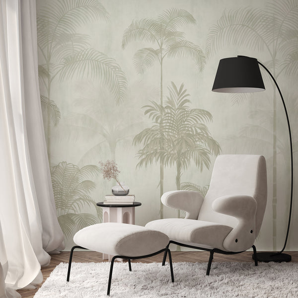 Sage green tropical wall mural with graceful palm trees and layered foliage in soft green and cream tones for a minimalist bedroom interior.