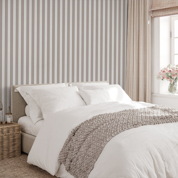 Modern striped wallpaper in taupe and white with a balanced vertical pattern, ideal for bedrooms, living rooms, entryways, or minimalist spaces.
