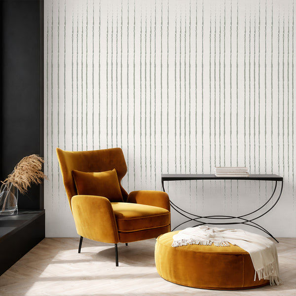 Close-up view of the sage green sketched lines on a warm off-white linen-like wallpaper backdrop.