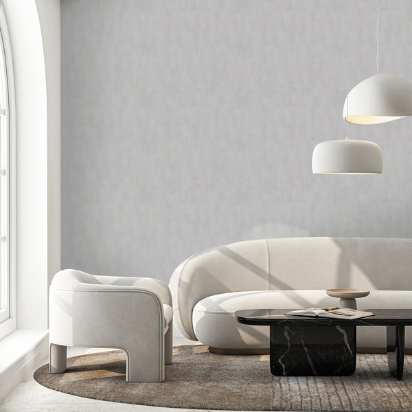 Neutral plaster-effect wallpaper with gentle tonal shifts, perfect for creating an architectural feel in modern spaces.