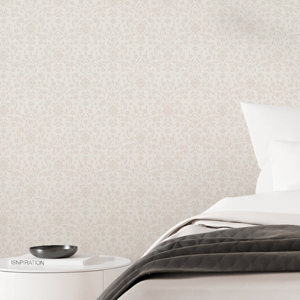 Vintage-inspired beige wallpaper featuring repeating damask botanical vines, simple flower silhouettes and a soft textured finish for cottagecore interiors.