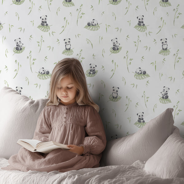 Cute panda wallpaper with watercolor black and white bear, pale green leaf and bamboo details for a sweet neutral nursery or kids room.