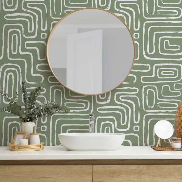 Close-up of Olive Boho Line Wallpaper showcasing a painterly texture with visible brush-edge breaks and internal voids. The pattern's generous spacing and matte surface enhance its suitability for accent walls in living rooms, bedrooms, or home offices. Easy to apply and reposition, made in the USA with eco-friendly materials.