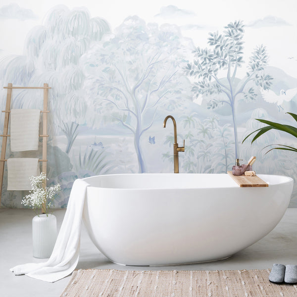 Pastel blue swan wall mural featuring graceful birds, botanical trees, misty mountains and soft nature details for a nursery or bedroom.