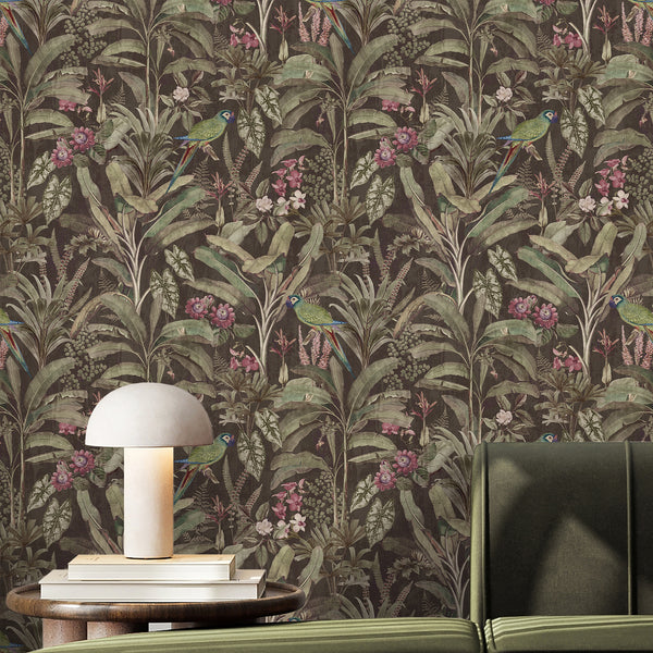 Moody tropical wallpaper with green parrots, pink flowers, banana leaves and dense vintage botanical foliage on a textured dark brown background.