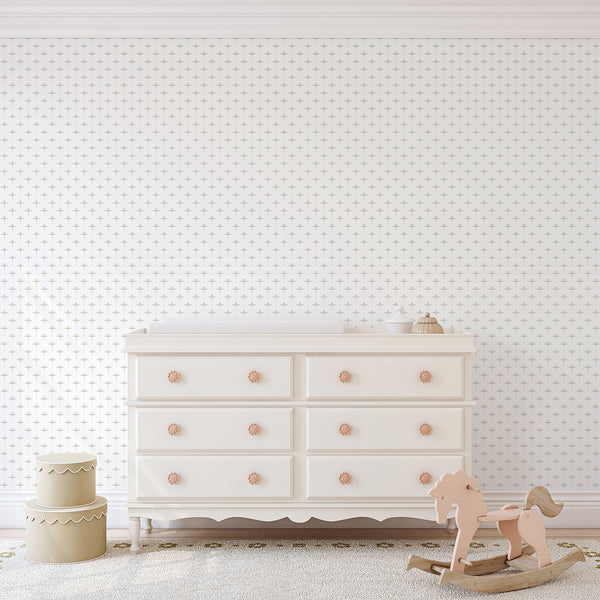 Soft pink and green nursery wallpaper featuring a small repeating flower motif with minimalist leaves and dotted vertical stems on a white background.