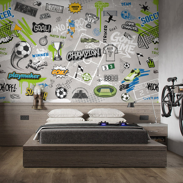 Energetic soccer graffiti mural with stenciled words and neon accents, creating a statement piece for a kids' playroom. The removable design allows for easy installation, making it a great choice for renters and decorators aiming for a modern urban style.