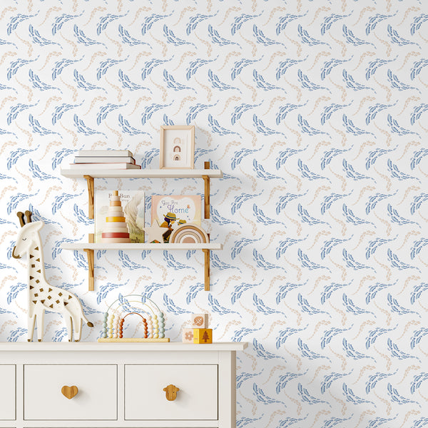 Nautical nursery wallpaper with watercolor schools of blue and neutral fish, creating a light ocean-inspired look for a baby or toddler room.