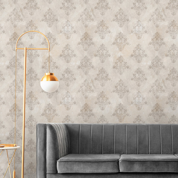 Distressed beige damask wallpaper featuring softly faded floral ornaments and an antique-inspired textured background for bedroom and living room walls.