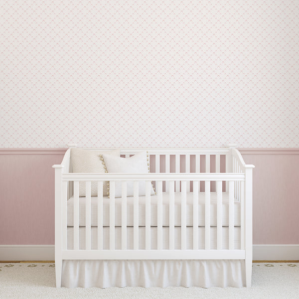 Minimal pink bow wallpaper with delicate watercolor texture, designed for a baby girl nursery, kids bedroom, playroom, or dressing area.