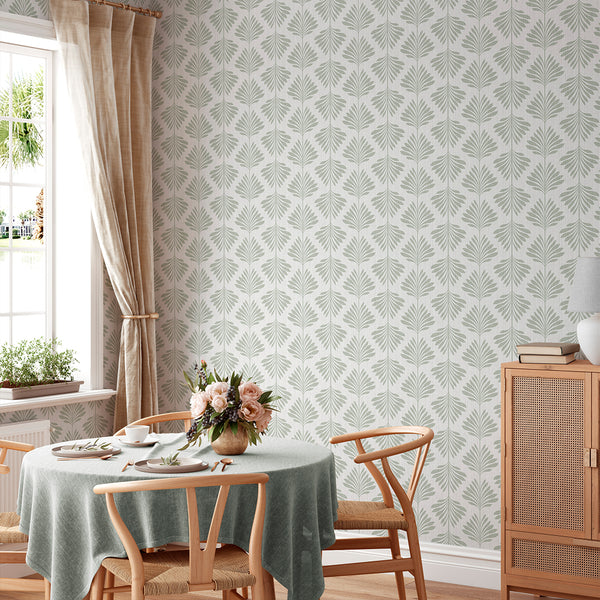Featuring a low-contrast, tonal look with sage green palm fronds, this wallpaper suits transitional interiors. The pre-pasted design is eco-friendly and Made in the USA, providing a seamless solution for decorators.