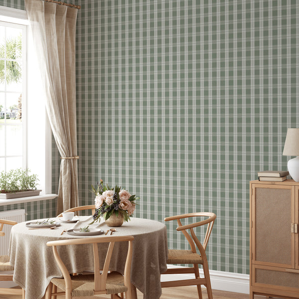 Cottagecore wallpaper in dark green and sage with classic intersecting plaid lines, creating a warm backdrop for bedrooms and living rooms.