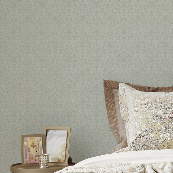 Vintage farmhouse damask wallpaper featuring pale sage floral silhouettes and elegant winding vines against an ivory textured background for bedroom walls.