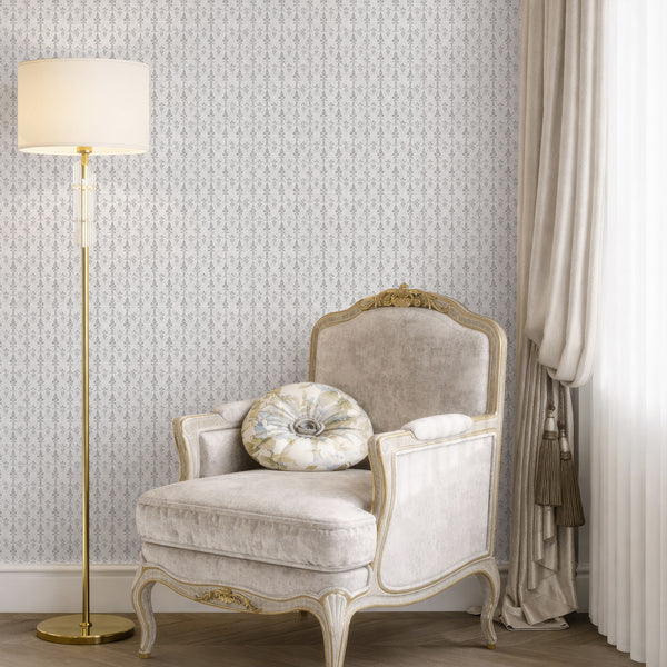 Stylized gray damask wallpaper with narrow vertical motifs, ideal for creating a refined, vintage-washed look in cottage or French country spaces. The eco-friendly wallpaper's subtle cool gray pattern enhances the sophistication of hallways or living rooms.