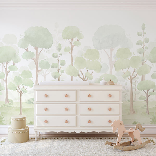 Sage green forest wallpaper mural with soft watercolor trees, rounded leafy canopies, and delicate woodland scenery on a light ivory background for a nursery.