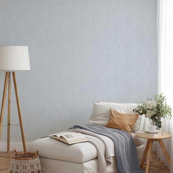 Soft pale blue wallpaper mimicking real plaster with gentle depth and tonal shifts, perfect for a calm home office or hallway.