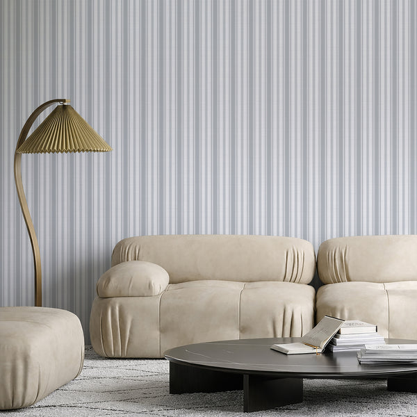 Coastal striped wallpaper with narrow blue gray and white vertical lines and fine herringbone-style detailing, ideal for beach house bedrooms and relaxed interiors.