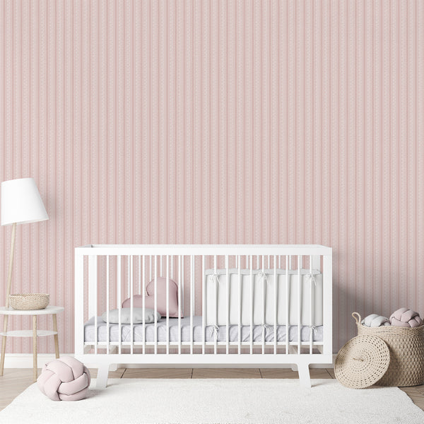 Cottagecore wallpaper in dusty pink with white floral vines, decorative wavy borders, and a softly textured background for cozy bedroom interiors.