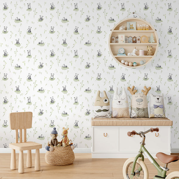 Neutral nursery wallpaper with a cute panda bear, pale green leaf and watercolor bamboo branches for a soft botanical baby room design.